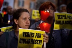 FILE - Amnesty International activists hold a candle light vigil in Rome's Pantheon square, July 25, 2016, in remembrance of the late Italian student Giulio Regeni.