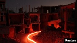 Les bâtiments endommagés dans la zone tenue par les rebelles, dans la ville de Deraa, en Syrie, le 15 juillet 2017.