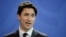 FILE - Prime Minister of Canada Justin Trudeau attends a news conference with German Chancellor Angela Merkel after talks at the chancellery in Berlin, Feb. 17, 2017. 