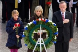 FILE - In this Nov. 22, 2013, file photo, former Ambassador to Ireland Jean Kennedy Smith, center lays a wreath at John F. Kennedy's grave in Arlington, Virginia.