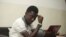 Rashidi Williams, a gay man, works on his laptop in Lagos, Nigeria, in this Nov. 17, 2011 photo.