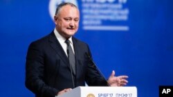 FILE - Moldovan President Igor Dodon addresses the St. Petersburg International Economic Forum in St. Petersburg, Russia, June 2, 2017. 