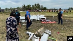 Wreckage of an airplane lies in a rice field in Maguindanao del Sur province, Philippines, after a U.S. military-contracted plane crashed, killing all four people on board, on Feb. 6, 2025.