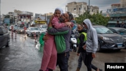 Mohammed Sleem hugs his girl  Menisa Sleem, arsenic  helium  meets her aft  2  months, according to Mohammed, aft  a cease-fire betwixt  Israel and Iran-backed radical  Hezbollah took effect, successful  Tyre, Lebanon, Nov. 27, 2024.