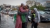 Mohammed Sleem hugs his daughter Menisa Sleem, as he meets her after two months, according to Mohammed, after a cease-fire between Israel and Iran-backed group Hezbollah took effect, in Tyre, Lebanon, Nov. 27, 2024. 