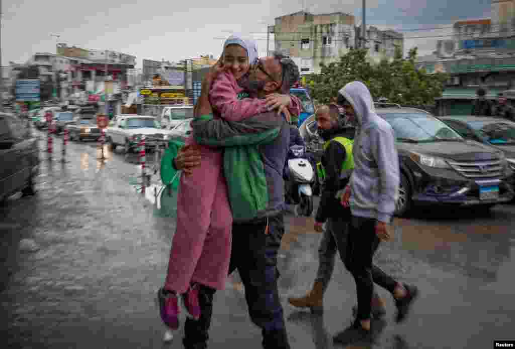 Mohammed Sleem hugs his daughter Menisa Sleem as he meets her after two months, according to Mohammed, after a cease-fire between Israel and Iran-backed group Hezbollah took effect, in Tyre, Lebanon.&nbsp;U.S. President Joe Biden said both sides accepted an agreement brokered by the United States and France.