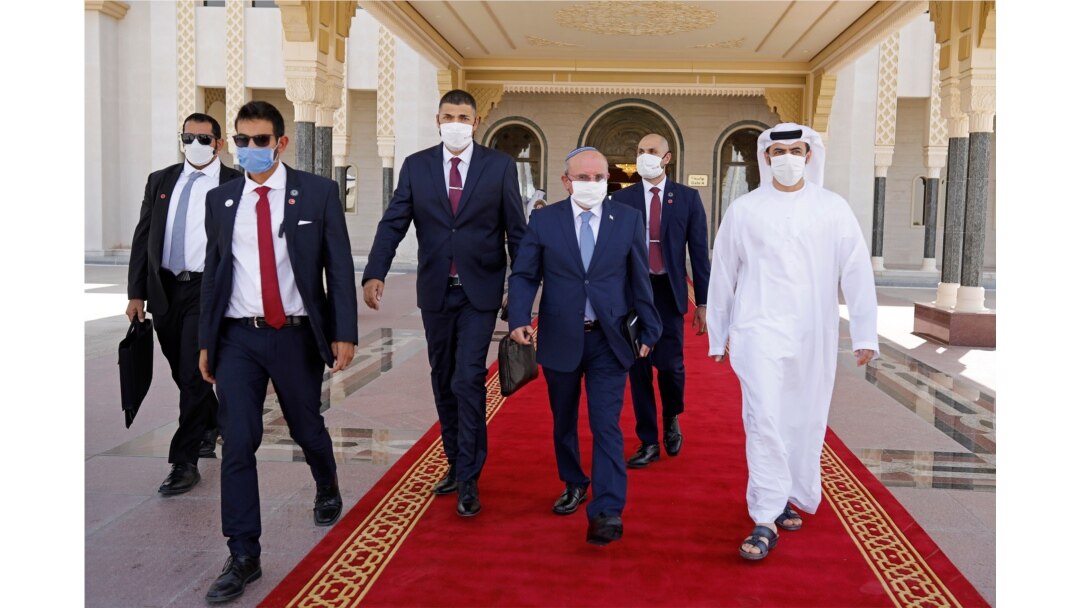 Israeli National Security Advisor Meir Ben-Shabbat, center, walks toward a plane as he leaves Abu Dhabi, Arab Emirates, Sept. 1, 2020.