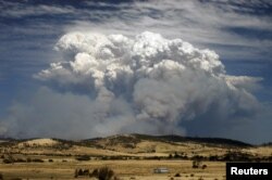 Smoke from wildfires is seen east of Hobart in the Australian island state of Tasmania Jan. 4, 2013.