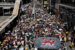 Anti-extradition bill protesters march during the anniversary of Hong Kong's handover to China, in Hong Kong, July 01, 2019.