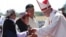 Pope Francis greets Mapuches in an offertory of a Mass at the Maquehue Air Base, in Temuco, Chile, Jan. 17, 2018. 