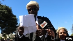 FILE - John Suzi Banda reads a statement of judicial independence during demonstrations in Blantyre, Malawi, June 17, 2020. (Lameck Masina/VOA)