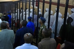 A partial view shows the trial of Sudan's ousted president Omar al-Bashir along with other co-accused at the Khartoum courthouse in the Sudanese capital, July 21, 2020.