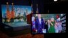 Democratic presidential candidate former Vice President Joe Biden is seen in a video feed from Delaware as he reacts with his wife Jill Biden and his grandchildren at his side, after winning the votes to become the Democratic Party's 2020 nominee for Pres