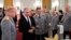 FILE - Russian President Vladimir Putin, second left, and Defense Minister Sergei Shoigu, center, toast with champagne during an awards ceremony for troops who fought in Syria, in the Kremlin, in Moscow, Dec. 28, 2017. Putin says Russia's action in Syria has demonstrated the power of the nation's modernized military to the world. 