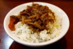 FILE - A bowl of rice with minced pork, a popular Taiwanese style dish, is seen at a restaurant in Taipei, Taiwan, July 26, 2017.