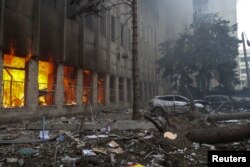 A printing house hit by a Russian missile strike burns in Kharkiv, Ukraine, on March 20, 2024.
