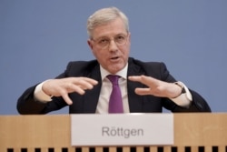 FILE - Norbert Roettgen, Chairman of the Foreign Affairs Committee of the Bundestag, speaks during a press conference in Berlin, Germany, Feb. 18, 2020.