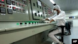 FILE - In this Feb. 3, 2007 file photo, a technician works at the Uranium Conversion Facility just outside the city of Isfahan, Iran, 255 miles (410 kilometers) south of the capital Tehran. Iran announced Saturday, Sept. 7, 2019, it had begun using…