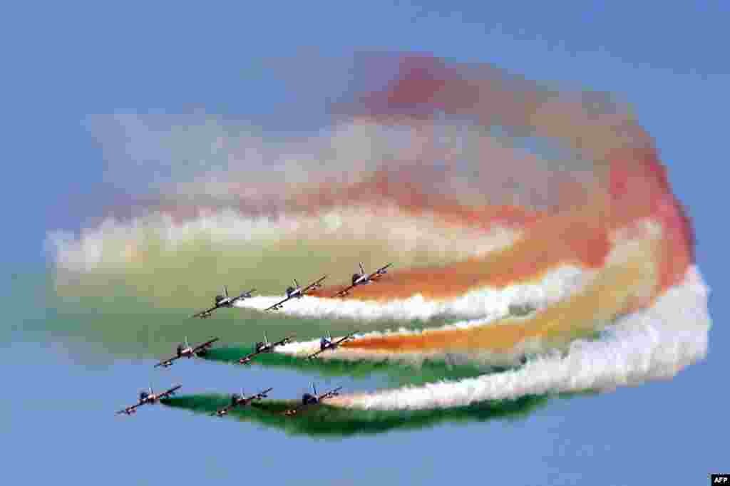 Special Italian airforce unit &quot;Frecce Tricolori&quot; (Tri-color Arrows) spread smoke with the colors of the Italian flag over the military parade at Via dei Fori Imperiali avenue in central Rome to mark the Republic Day.