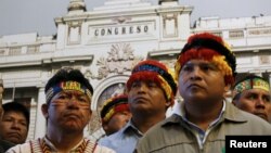 FILE - Chiefs of indigenous communities of the Amazonas attend a news conference in Lima, Aug. 13, 2015. Indigenous communities near Peru's biggest oil field, block 192, pressed for better benefits and environmental monitoring.