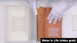 The Drinkable Book was developed to filter polluted water.