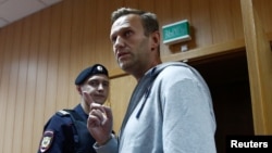 Russian opposition leader Alexei Navalny, who was recently detained over his participation in an anti-government protest in Jan. 2018, attends a court hearing in Moscow, Aug. 27, 2018.