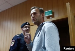 Russian opposition leader Alexei Navalny, who was recently detained over his participation in an anti-government protest in Jan. 2018, attends a court hearing in Moscow, Aug. 27, 2018.