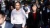 Former New York Governor Kathy Hochul aide Linda Sun, right, and her husband, Christopher Hu, leave Brooklyn Federal Court after their arraignment in New York, Sept. 3, 2024.