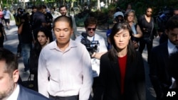 Former New York Governor Kathy Hochul aide Linda Sun, right, and her husband, Christopher Hu leave Brooklyn Federal Court after their arraignment in New York, Sept. 3, 2024.