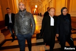 Latifa Ibn Ziaten (R), mother of a French soldier slain by Islamist Mohammed Merah in 2012, arrives at the trial of Abdelkader Merah, brother of the gunman, Paris, France, Oct. 2, 2017.