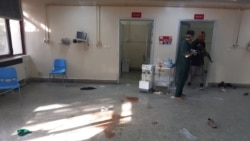 People walk inside the Children's Hospital after an explosion near the Sardar Mohammad Daud Khan National Military Hospital in central Kabul, Afghanistan Nov. 2, 2021.