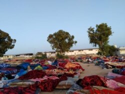 After the detention center was bombed, remaining structures appeared unstable and five days later, migrants were still sleeping outdoors. Pictured and transmitted to VOA July 7, 2019, in Tripoli, Libya.
