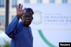 FILE -- Bola Tinubu, President of Nigeria, arrives for the closing session of the New Global Financial Pact Summit, June 23, 2023 in Paris, France.