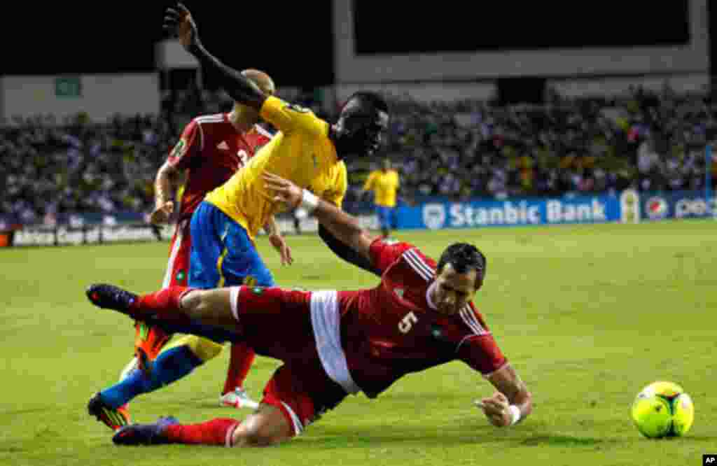 Morocco's Amine is tackled by Gabon's Mouloungui during their African Cup of Nations soccer match in Libreville