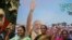 Supporters of India's ruling Bharatiya Janata flash victory signs as they celebrate outside their party office in Mumbai, India, Oct. 24, 2019.