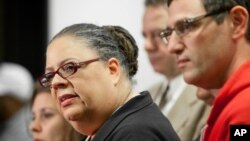 Chicago Teachers Union President Karen Lewis, left, answers reporters' questions at a news conference following a meeting of CTU delegates Sunday, Sept. 16, 2012 in Chicago.
