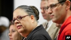 Chicago Teachers Union President Karen Lewis, left, answers reporters' questions at a news conference following a meeting of CTU delegates Sunday, Sept. 16, 2012 in Chicago.