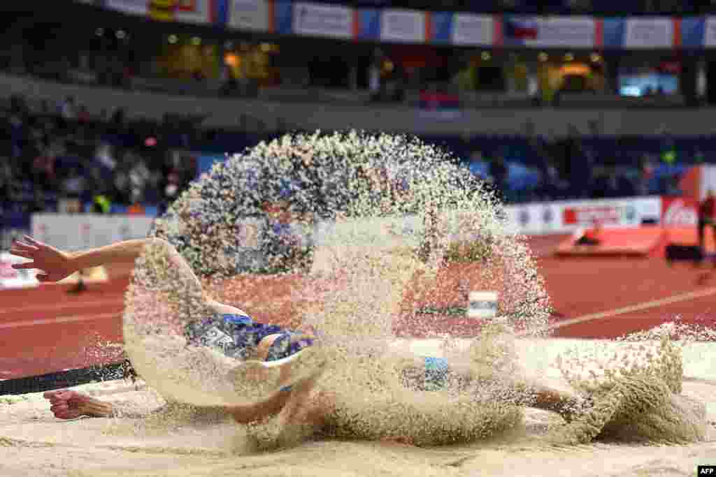 Estonia&#39;s Henrik Kutberg competes in the men&#39;s long jump qualifications at the 2017 European Athletics Indoor Championships in Belgrade, Serbia.