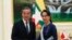 Myanmar's de facto civilian leader Aung San Suu Kyi, right, shakes hands with Chinese Foreign Minister Wang Yi, left, during their meeting at the President House in Naypyitaw, Myanmar, Dec. 7, 2019.