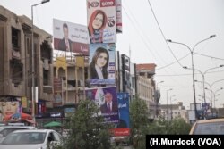 Campaign posters line the streets of Baghdad, May 7, 2018. (H.Murdock/VOA)