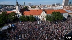 Demonstrators hold up flags of Slovakia and EU during an anti-corruption rally in Bratislava, Slovakia, June 5, 2017. 