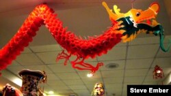 Chinatown restaurant dragon hovers above diners