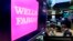 FILE - The Wells Fargo logo appears above a trading post on the floor of the New York Stock Exchange, Feb. 7, 2018. 