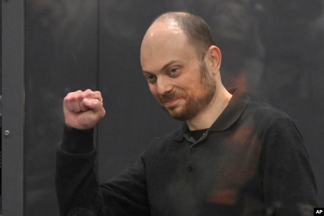 FILE - Russian opposition activist Vladimir Kara-Murza gestures while standing in a defendants’ cage in a courtroom in Moscow, Russia, on July 31, 2023.(AP Photo, File)