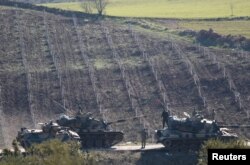 Turkish Army tanks are seen near the Turkish-Syrian border in Kilis province, Turkey Jan. 31, 2018.