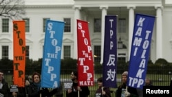 FILE - Opponents of the Trans-Pacific Partnership (TPP) trade agreement protest outside the White House in Washington, Feb. 3, 2016. 