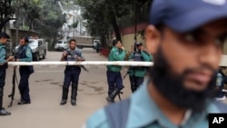 Bangladeshi police stand guard in front of the house of former Prime Minister and main opposition Bangladesh Nationalist Party (BNP) leader Khaleda Zia during a 48-hour nationwide strike called by her party, in Dhaka, Bangladesh, Jan. 6, 2014. 