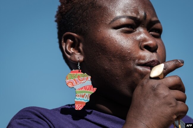 A woman participates in a feminist march, held to call a halt to the nation's femicide, in Nairobi, March 8, 2019.