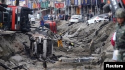 Rescue personnel survey the wreckage after an explosion in Kaohsiung, southern Taiwan, August 1, 2014.