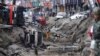 Rescue personnel survey the wreckage after an explosion in Kaohsiung, southern Taiwan, August 1, 2014.